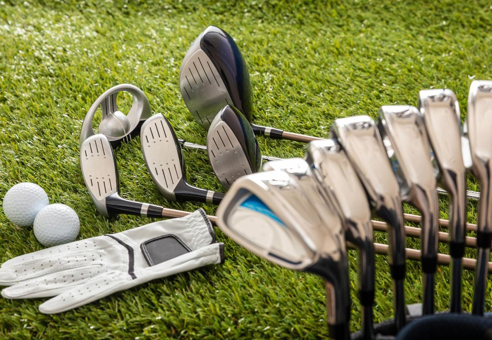 Golf equipment on green grass golf course close up view