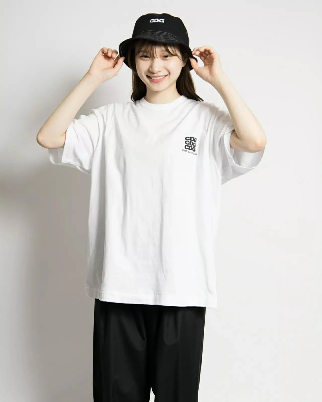 Casual Streetwear Look with CDG Tee and Bucket Hat